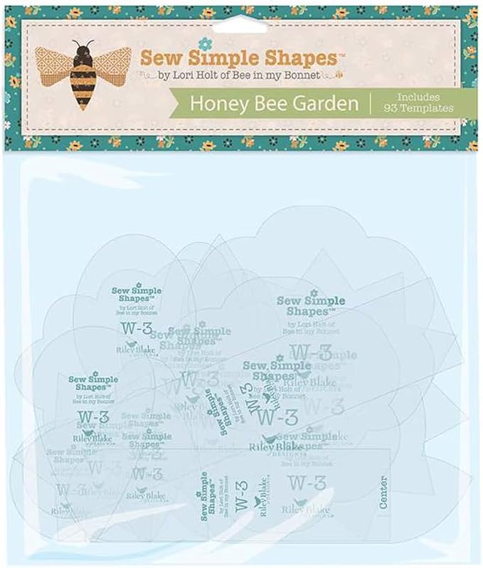 Lori Holt Honey Bee Garden Sew Simple Shapes set showing clear plastic applique templates arranged on a floral background