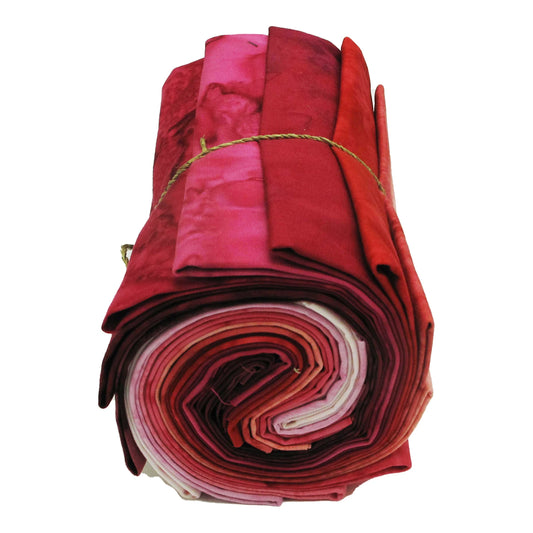 Hoffman Fabrics 1895 Batiks Pink Colorway fat quarter bundle with 12 rolled pink batik quilting fabrics from deep magenta to soft blush
